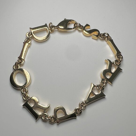 CHRISTIAN DIOR LOGO PARIS GOLD TONE BRACELET - Picture 1 of 4